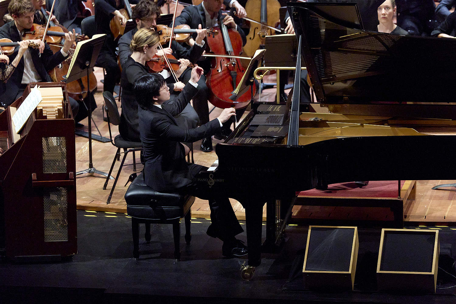 © Dougados Magali Pianist Kit Armstrong playing Olivier Messiaen's Turangalîla-Symphonie at a symphony concert conducted by Bertrand de Billy with Martenot wave player Cécile Lartigau and the Orchestre de la Suisse Romande at Geneva's Victoria Hall.