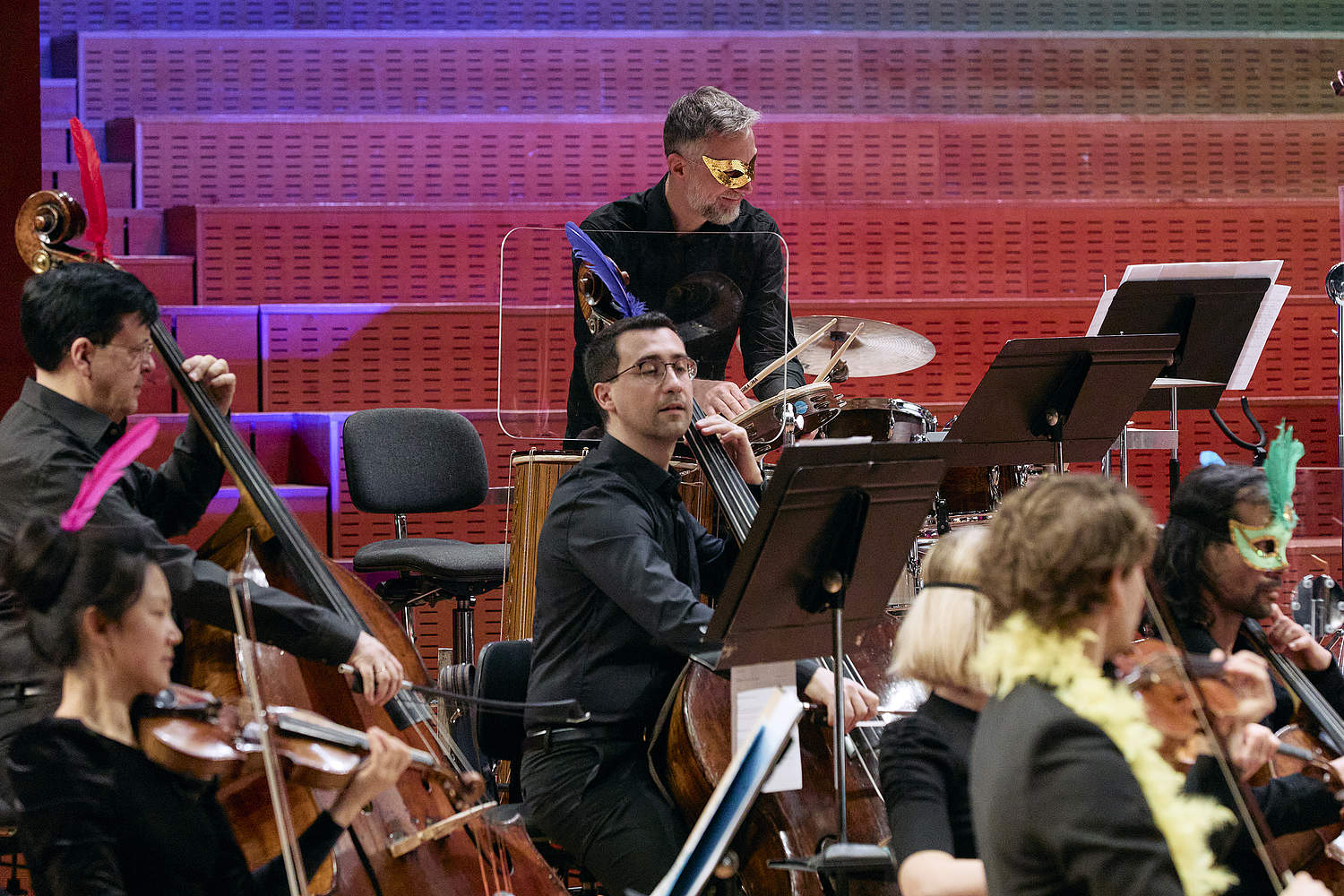 © Dougados Magali Musicians at the Orchestre de la Suisse Romande during the family concert “Le Carnaval d'Aldo” dressed with carnival accessories on the stage of Geneva's Victoria Hall.